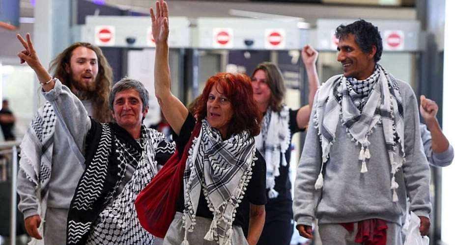French activists from the Gaza-bound Global Sumud Flotilla gesture upon arrival at Charles de Gaulle Airport near Paris, on May 22, 2026. -  Abdul Saboor, Reuters