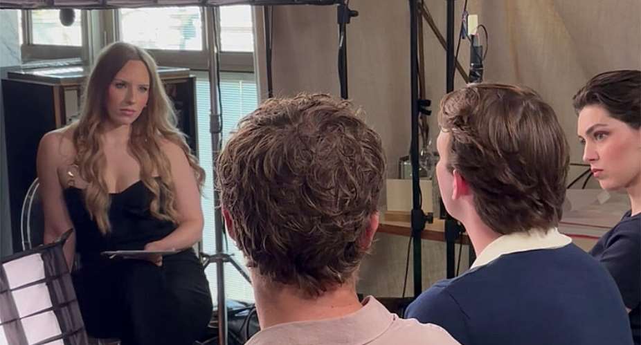 We see two male actors and one female actor from behind, and Nina Masson, a FRANCE 24 journalist, facing the camera, during an interview to promote the film *Charles de Gaulle*. -  Yong Chim