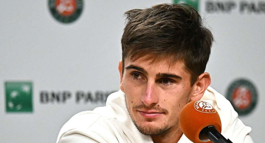 Getty ImagesImage caption: Matteo Arnaldi looked peaky when he talked to the media about pulling out of the French Open