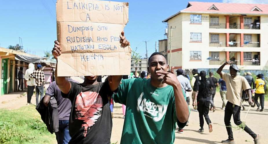 Demonstrators participate during a protest against a US-backed Ebola quarantine plan on the establishment of a facility to host Americans exposed to Ebola, in Nanyuki town, in Laikipia County, Kenya, on 1 June, 2026. - REUTERS - John Muchucha