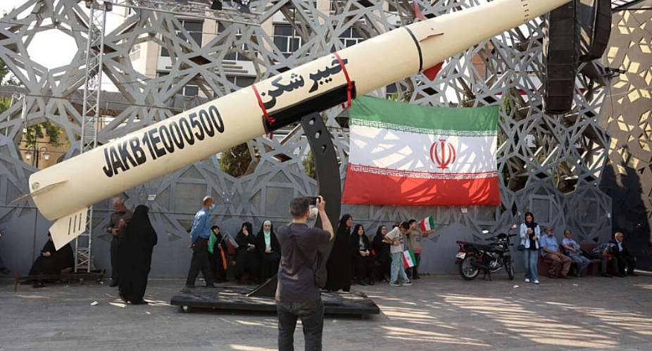 File photo of Iranians next to a symbol of a Kheibar missile taken during a rally in Tehran on June 4, 2026. -  AFP