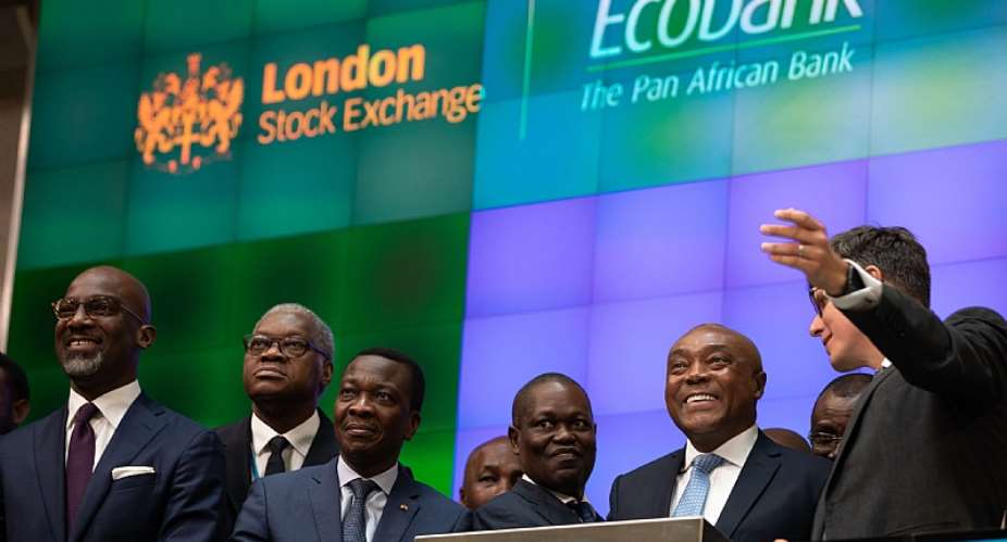 Ecobank Chairman Emmanuel Ikazoboh 2nd from left opens the London Stock Exchange with Group CEO Ade Ayeyemi 3rd from left