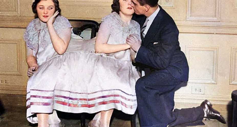 Margaret Gibb gets a kiss from her boyfriend while her sister Mary looks on in the 1940s