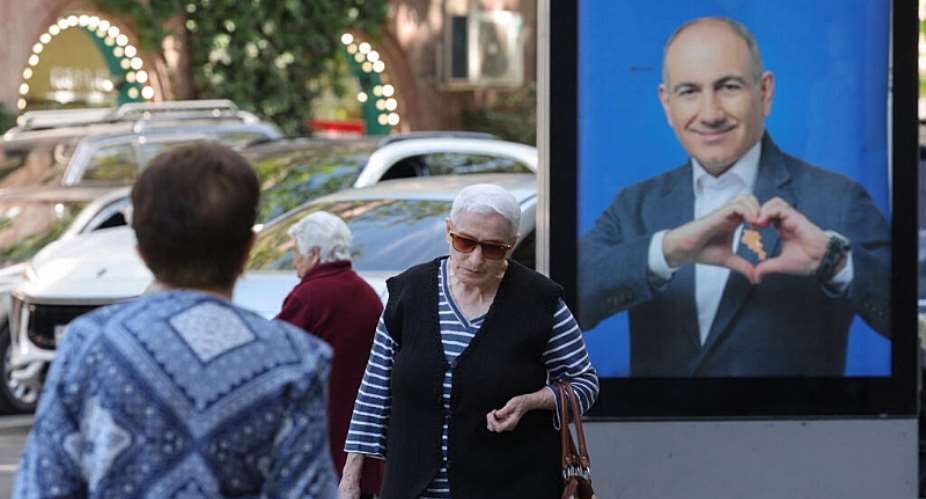 In Yerevan, Armenia, people walk past campaign posters with portraits of Prime Minister Nikol Pashinyan ahead of the parliamentary election on 7 June 2026. -  Hayk Baghdasaryan/Photolure via REUTERS