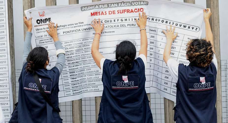 Peruvian electoral workers place a polling station list in Lima, Peru on June 6, 2026. -  Stifs Paucca, Reuters