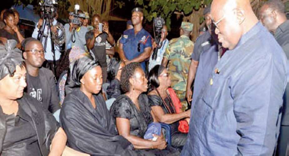 Nana Addo consoling the wife of the deceased, Barbara Mahama