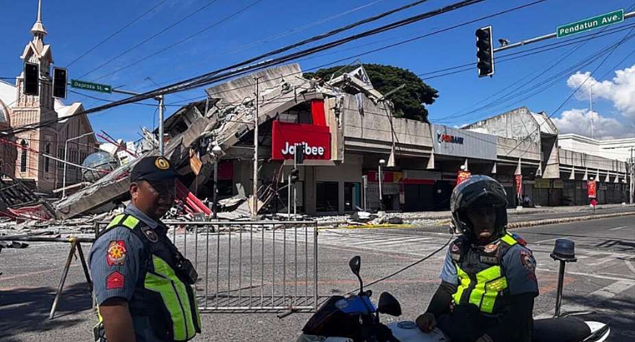 Buildings including a Jolibee restaurant collapsed following a 7.8-magnitude earthquake that hit off Mindanao island. -  Edwin Espejo, AFP