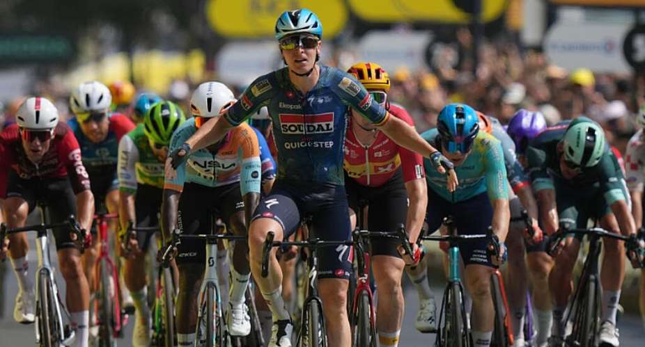 Belgiums Tim Merlier celebrates as he crosses the finish line to win the seventh stage of the Tour de France in Bordeaux, France, Friday, July 10, 2026. -  Thibault Camus, AP