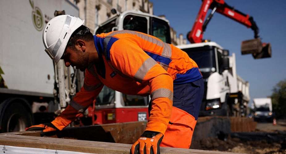 A construction worker resurfaces a road in Bordeaux during the heatwave in May when temperatures hit record highs across France, 28 May 2026. -  Alice Sacco/Reuters