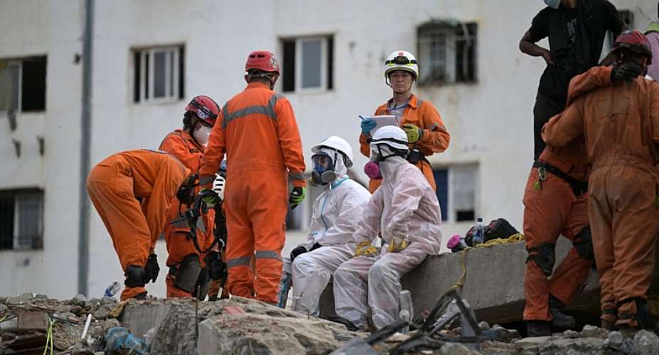 Argentine rescue workers prepare to recover bodies from a collapsed building in the Tanaguarena sector of Caraballeda, La Guaira state, Venezuela, on July 10, 2026. -  Juan Barreto, AFP