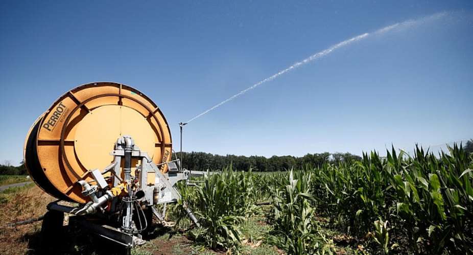 An irrigation sprinkler sprays water on a corn field in Parigne-lEveque near Le Mans on 8 July, 2026, as drought worsens in Sarthe department during a heatwave affecting a large part of the country. -  Benoit Tessier / REUTERS
