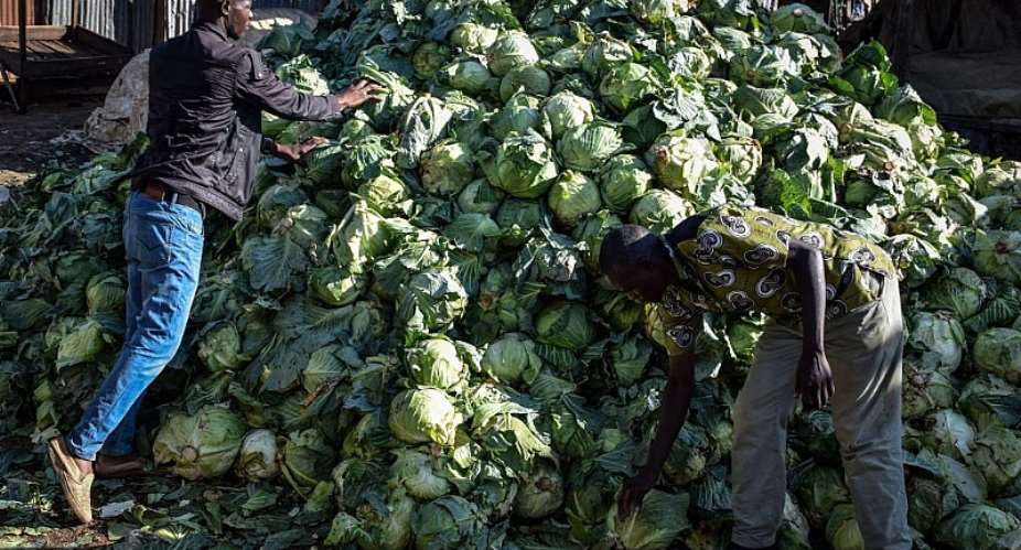 Traders leave their cabbages after the County Governor ordered the closure of the main open air market to curb the spread of the COVID-19 coronavirus in Kisumu, Kenya. - Source: CASMIR ODUORAFP via Getty Images