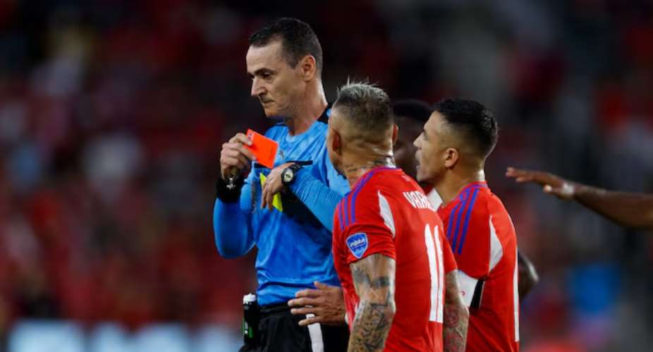 Jun 29, 2024; Orlando, FL, USA; Chile forward Eduardo Vargas (11) and forward Alexis Sanchez (10) interact with the referee after giving defender Gabriel Suazo (2) a red card against Canada during the first half at Inter&Co Stadium. Mandatory Credit: Morgan Tencza-USA TODAY Sports