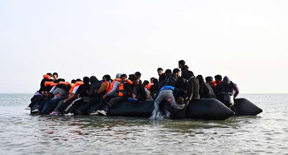 A group of people on an inflatable dinghy before leaving the coast of northern France in an attempt to cross the English Channel, from the beach of Petit-Fort-Philippe in Gravelines, near Calais, France, 23 May 2026. -  Dylan Martinez/Reuters