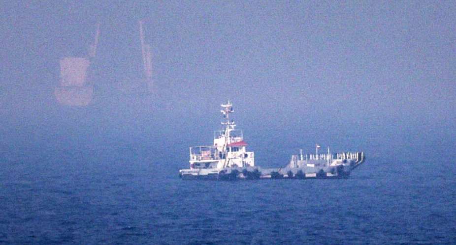Ships near the Strait of Hormuz off the eastern coast of the UAE at Khor Fakkan on July 13, 2026. - AFP - -