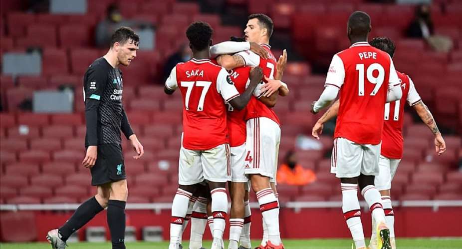 Reiss Nelson of Arsenal celebrates with teammates after scoring his sides second goal during the Premier League match between Arsenal FC and Liverpool FC at Emirates Stadium on July 15, 2020 in London, England.Image credit: Getty Images