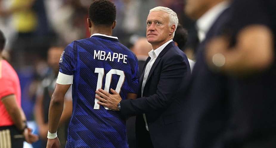 Didier Deschamps comforts Frances captain Kylian Mbapp after their crushing semi-final defeat against Spain. -  Lars Baron, Getty Images via AFP