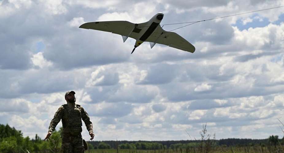 A serviceman of the State Border Guard Service of Ukraine launches an UAV for a patrol flight along the Ukraine-Belarus border in Chernigiv region on June 1, 2026, amid the Russian invasion of Ukraine. - AFP - GENYA SAVILOV