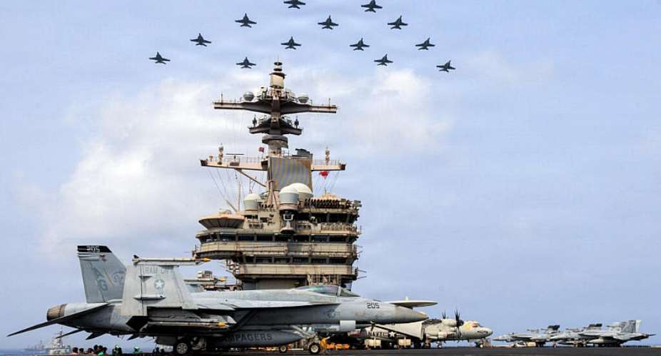 US Navy handout photo released July 15, 2026 and taken on June 30 shows Carrier Air Wing (CVW) 7 flying in formation over the USS George H.W. Bush in the Arabian Sea. -  AFP via US Navy handout