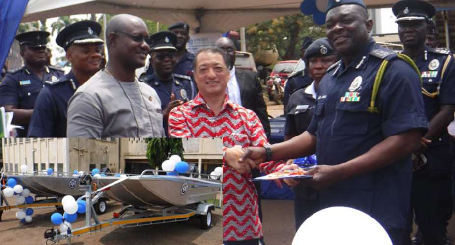The Japanese Ambassador handing over keys to the alligator boats to the IGP