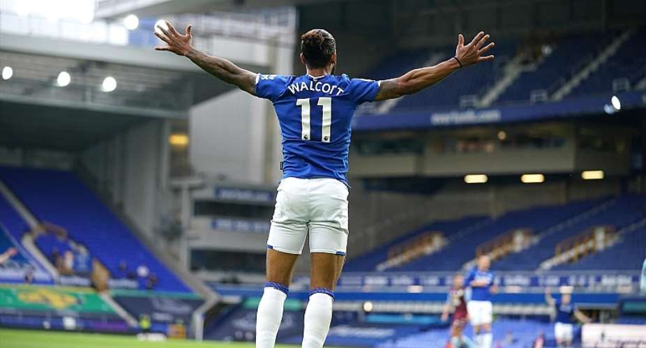 Theo Walcott of Everton celebrates after scoring his sides first goal during the Premier League match between Everton FC and Aston Villa at Goodison Park on July 16, 2020 in Liverpool, England. Football Stadiums around Europe remain empty due to the CoronImage credit: Getty Images