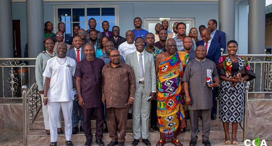 Prof. Samuel Ato Duncan in a group photograph with members of Parliamentary Select Committee on Health
