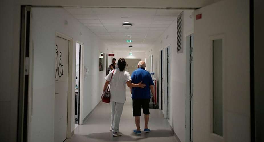 A nurse takes care of a man at the emergency department of the Paris-Saclay Hospital, near the French capital, on June 30, 2026. -  Christophe Ena, AP