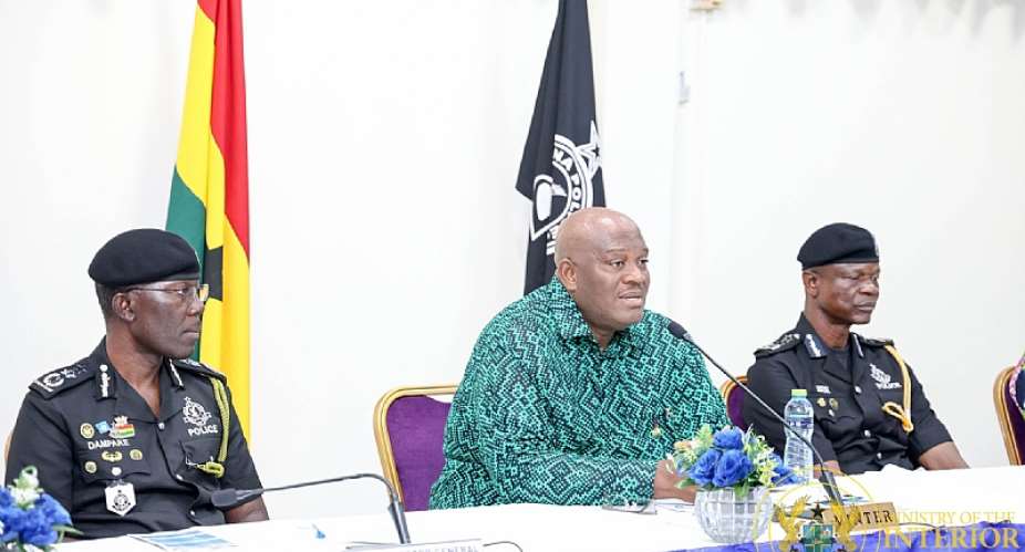 Interior Minister Henry Quarteyseated middle