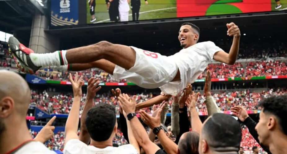 Azzedine Ounahi thrown in the air after Morocco secured quarter-final spot following Canadas defeat /  FIFA World Cup