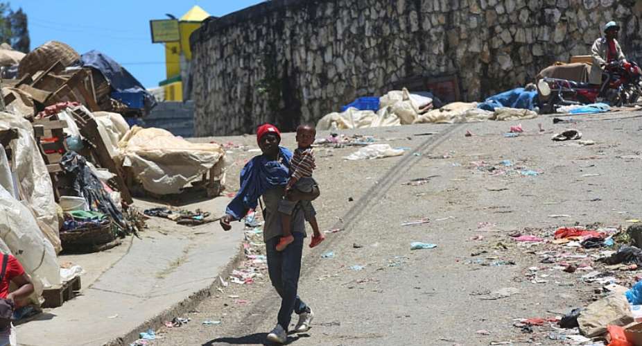 People on a road in Kenscoff, near Haitis capital Port-au-Prince, in April 2025. The town has been subjected to gang attacks since January 2025. -  AP/Odelyn Joseph