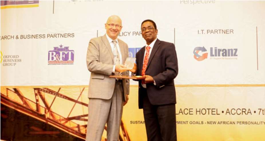 H.E. Gerhard Brgger presenting a the award citation & plaque to Professor Kwesi Yankah