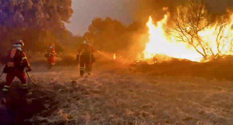 Video footage released on July 18, 2026 by Spains Military Emergencies Unit (UME) showing the military fighting a massive wildfire, in Luesia area, in a sparsely populated part of the Aragon region in northeastern Spain. - AFP - HANDOUT