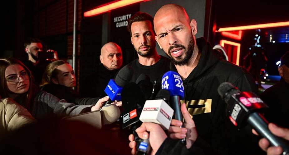 Social media influencer Andrew Tate and his brother Tristan speak to the press in Romania in March 2025. -  Daniel Mihailescu, AFP