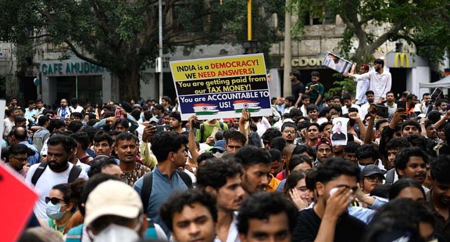 Activists and supporters of the Cockroach Janta Party  protest to demand the resignation of Indias Education Minister, Dharmendra Pradhan. -  Manan Vatsyayana, AFP