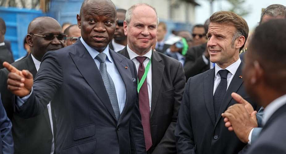 Gabons President Brice Oligui Nguema (2nd L) alongside Paulo Castellari (C), head of French metallurgical group Eramet, and Frances Emmanuel Macron in Libreville, 24 November, 2025. - AFP - LUDOVIC MARIN