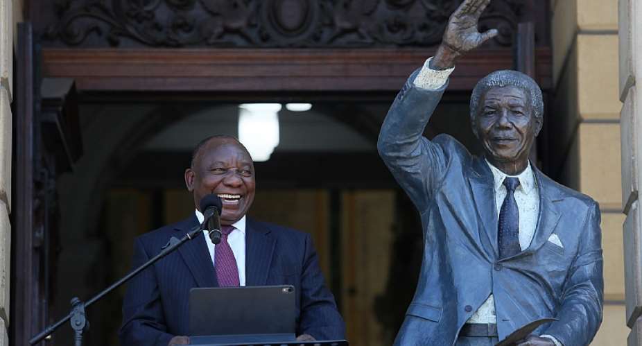 South African president Cyril Ramaphosa delivers a speech next to a statue of the late former president Nelson Mandela in Cape Town in 2020.  - Source: EPA-EFERuvan Boshoff