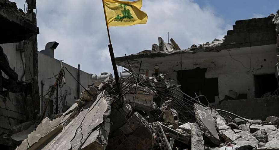 A yellow flag belonging to the Iran-backed Shia Muslim party Hezbollah flutters in Tyre, June 23, 2026 -  Joseph Eid, AFP