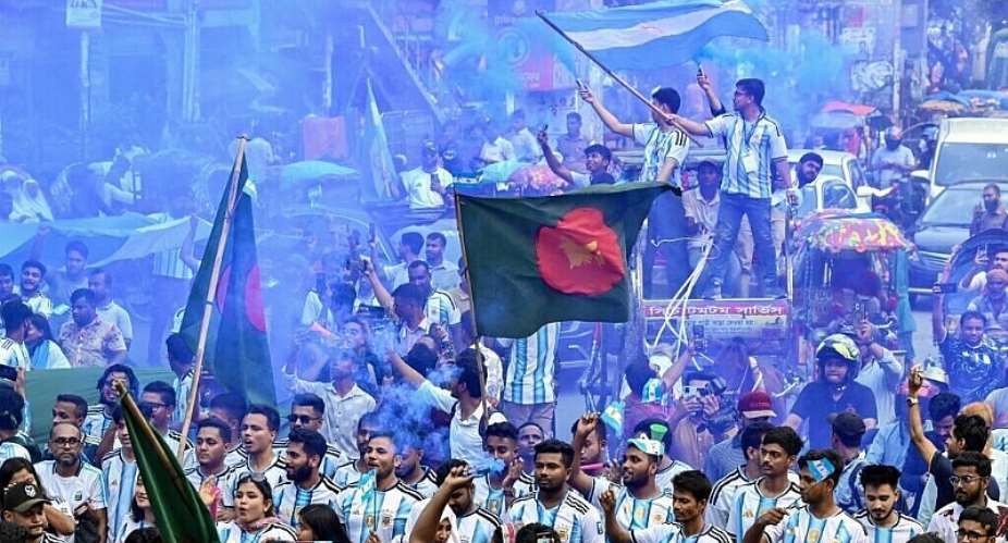 Bangladesh football fans decked in the colours of Lionel Messis Argentina march in Dhaka on June 16, 2026. -  Munir Uz Zaman, AFP