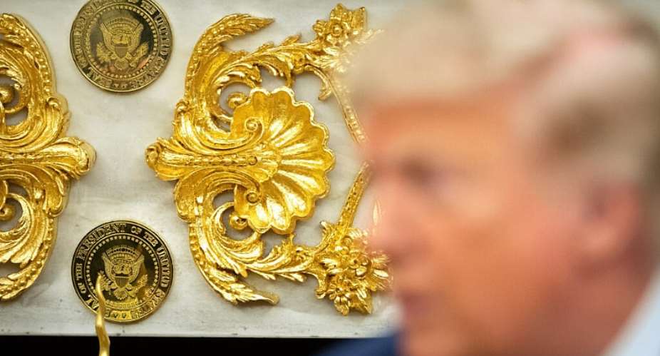 Gold-colored Presidential seals are seen on a fireplace in the Oval Office as President Donald Trump meets with Lebanese President Joseph Aoun on July 21, 2026. -  Mark Schiefelbein, AP