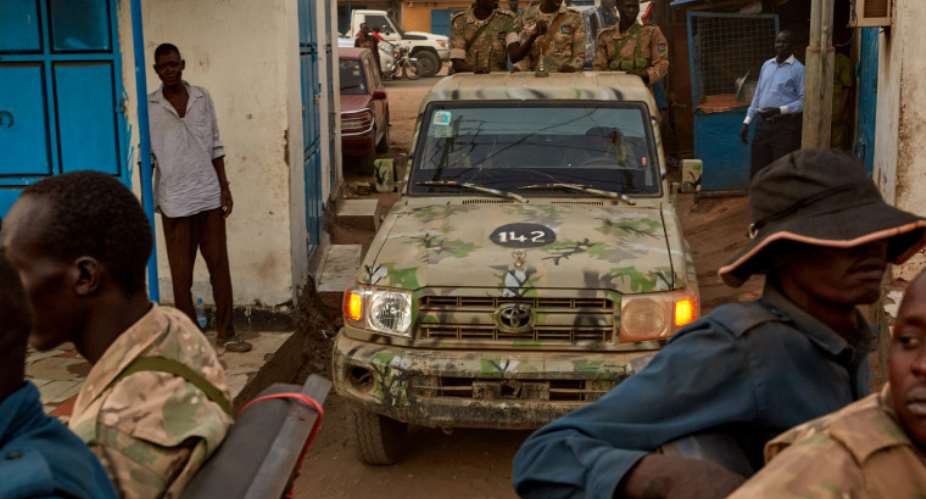 Security forces are seen in Juba, South Sudan, on April 9, 2020. Authorities recently detained journalist Alfred Angasi and have held him for weeks without charge. (AFP/Alex McBride)