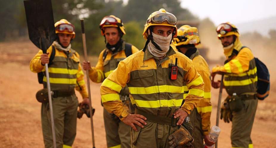 Forest rangers take a break before returning to work on the fire near Condemios de Arriba, Spain on July 22, 2026. -  Manu Fernandez, AP
