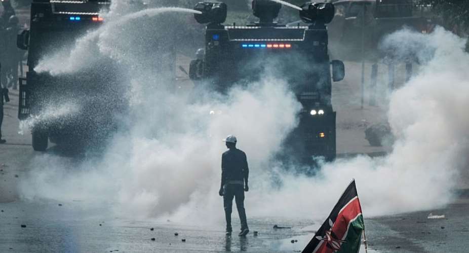 A protestor faces off with Kenyan police in Nairobi after the 2017 general election.  - Source: Yasuyoshi ChibaAFP via Getty Images