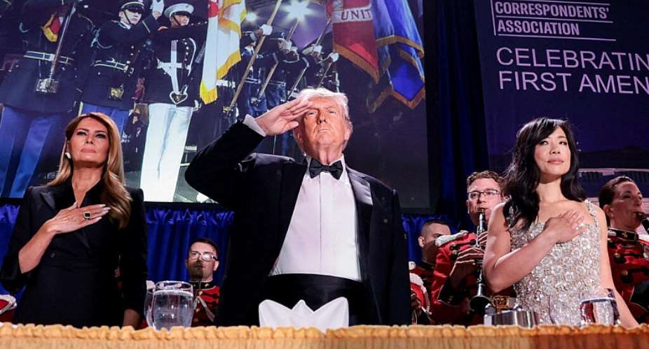 US President Donald Trump, with first lady Melania Trump and CBS News senior White House correspondent Weijia Jiang, salutes during the annual White House Correspondents Association dinner in Washington, DC, US, April 25, 2026. -  Jonathan Ernst, Reuters