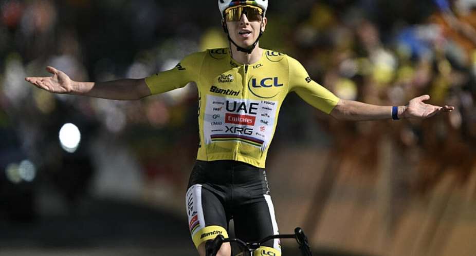 XRGs Slovenian rider Tadej Pogacar wearing the overall leaders yellow jersey cycles to the finish line to win the 19th stage of the 113th edition of the Tour de France cycling race on July 24, 2026. -  Jeff Pachoud, AFP