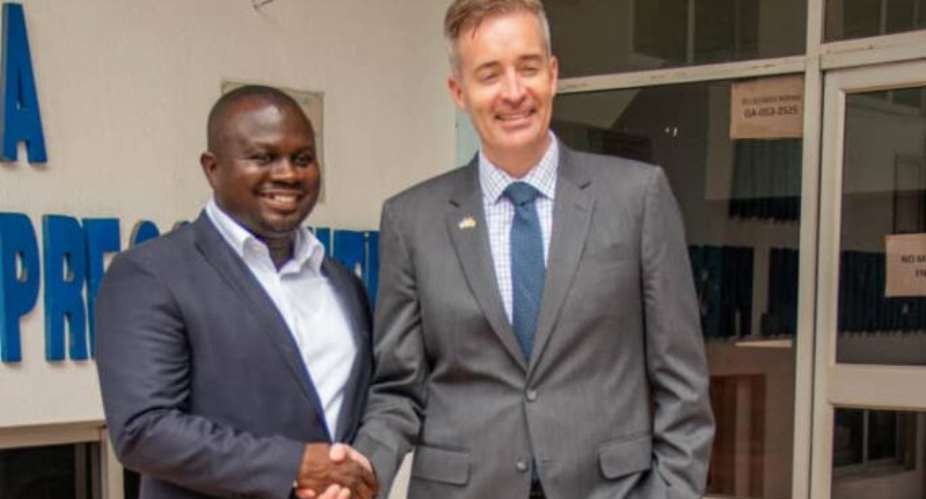 GJA President Mr. Albert Dwumfour in a handshake with Press Attache to US Embassy Mr. Kevin Brosnahan