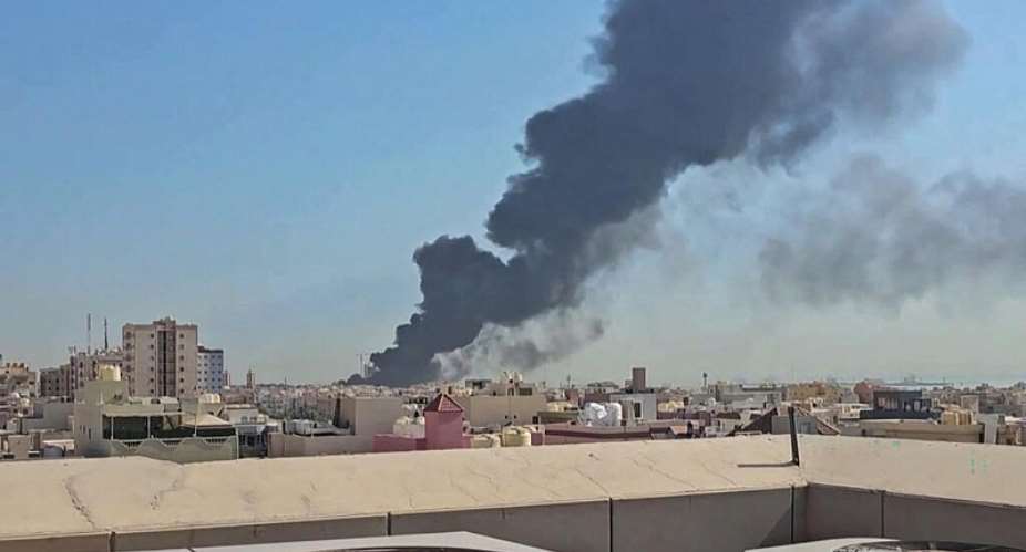This screen grab of video footage posted on social media on 18 July shows a plume of black smoke billowing over the town of Mangaf, south of Kuwait City. -  AFP