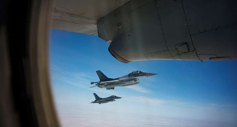 A file photo showing Romanian Air Force F-16 military fighter jets escorting a C-27J Spartan aircraft during a NATO Air Policing exercise above eastern Romania, on March 6, 2024. -  Andreea Alexandru, AP