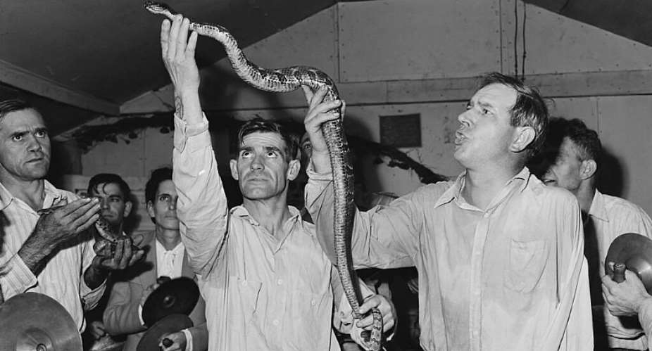 Snake handling at the Pentecostal Church of God in Lejunior, Kentucky, 15 September 1946. -  Russell Lee, National Archives and Records Administration NAID 541335, via Wikicommons