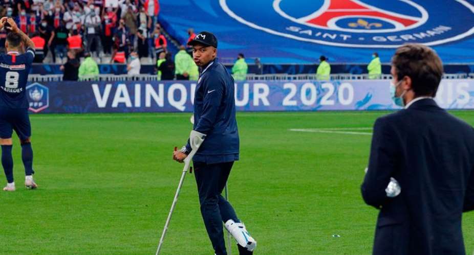 Paris Saint-Germain's French forward Kylian Mbappe walks with crutches after an injury during the French Cup final football match between Paris Saint-Germain PSG and Saint-Etienne ASSE on July 24, 2020, at the Stade de France in Saint-Denis, outside Paris. Photo by GEOFFROY VAN DER HASSELT  AFP Photo by GEOFFROY VAN DER HASSELTAFP via Getty Images
