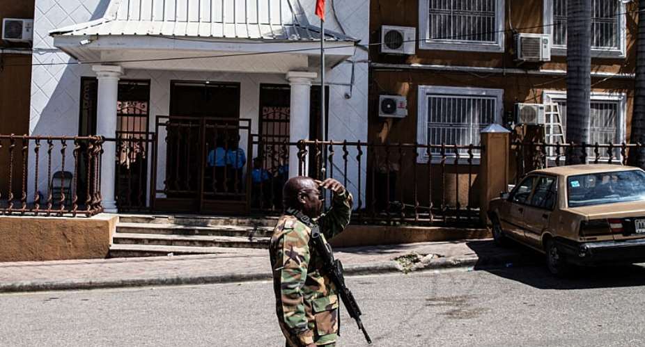 A soldier patrols in front of the Provisional Electoral Council (CEP) as the government announces the registration period for political parties ahead of the upcoming general election, in Port-au-Prince, Haiti, on March 3, 2026. -  Clarens Siffron, AFP